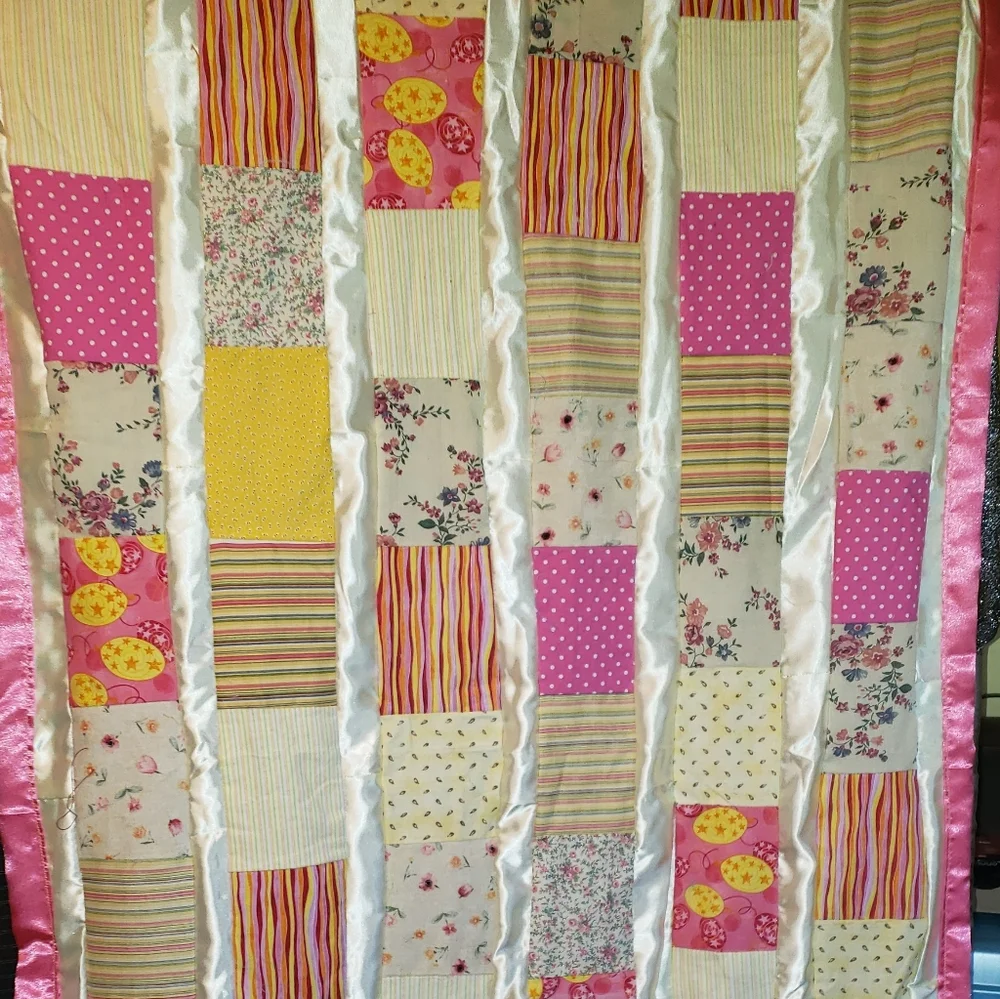 Patchwork Quilt with Pink and Yellow Accents